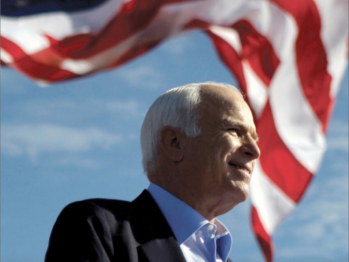 John McCain with American flag in background