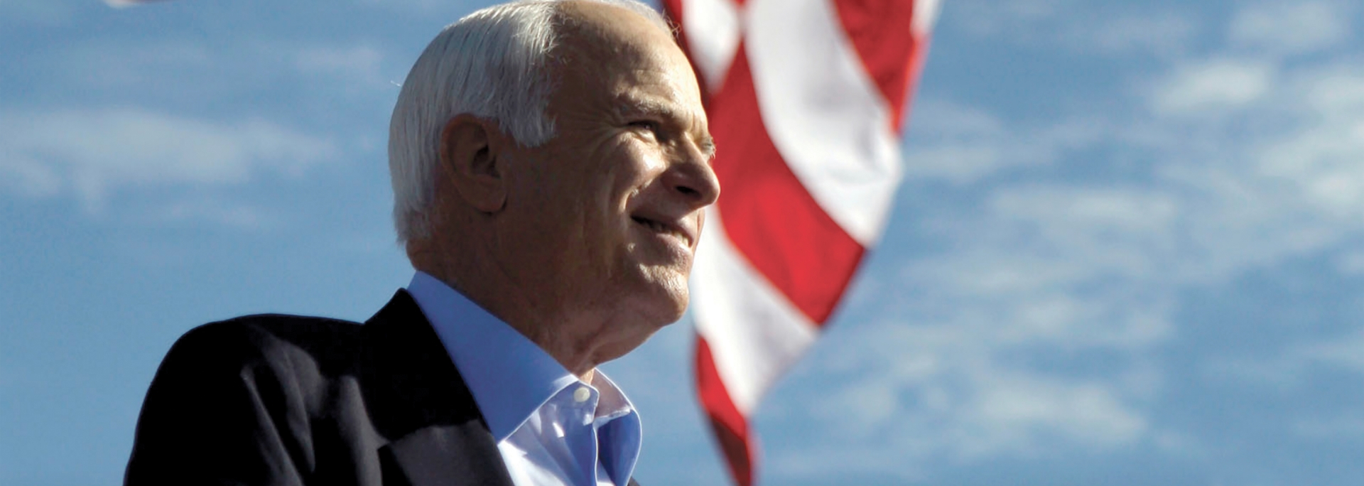 John McCain with American flag in background